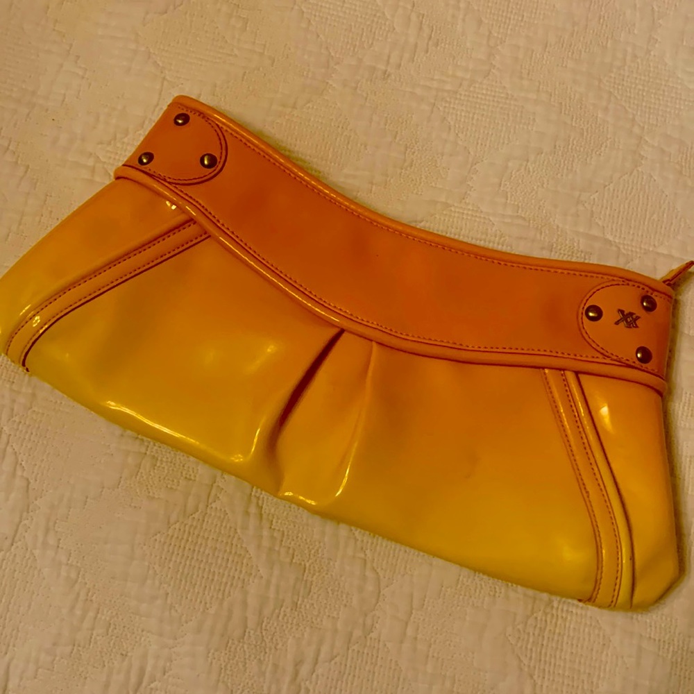 Maxx New York orange- yellow ombré clutch with tiger print interior